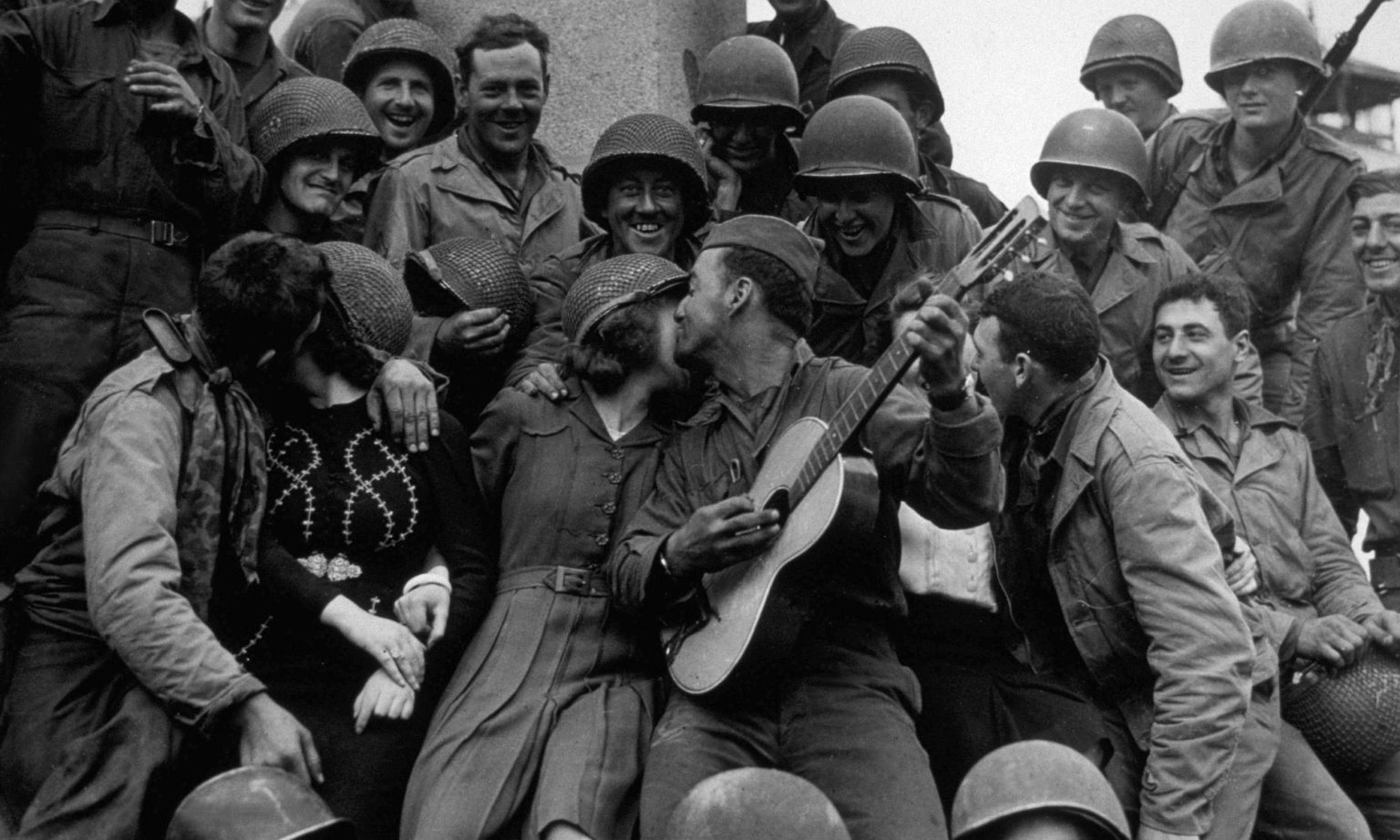 June 1944: American soldiers with inhabitants of Cherbourg, after its liberation. (Photo by Keystone/Getty Images)
