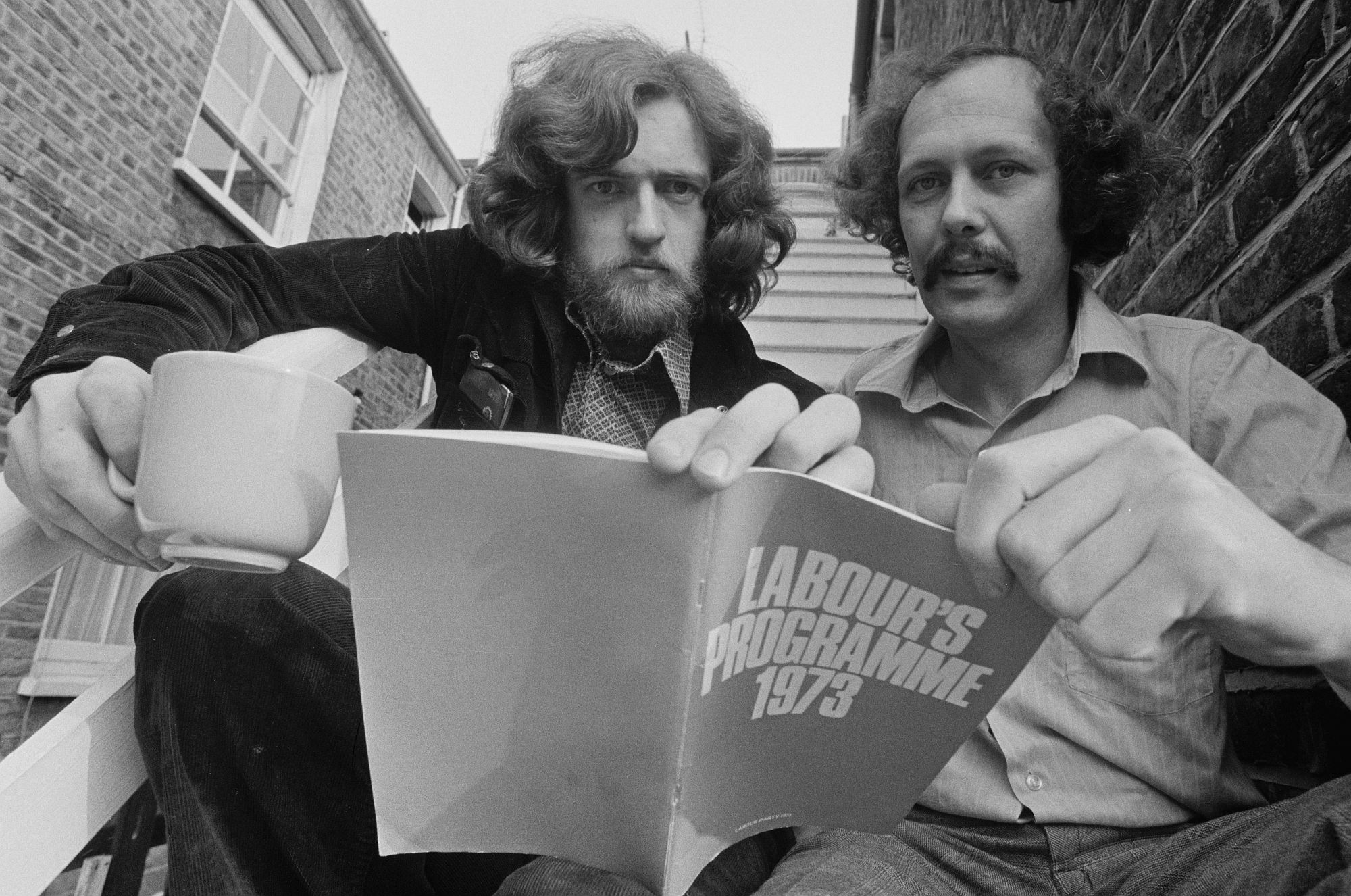 Then a borough councillor, Corbyn, with Les Silverstone, holds up a copy of a Labour left pamphlet, in 1975