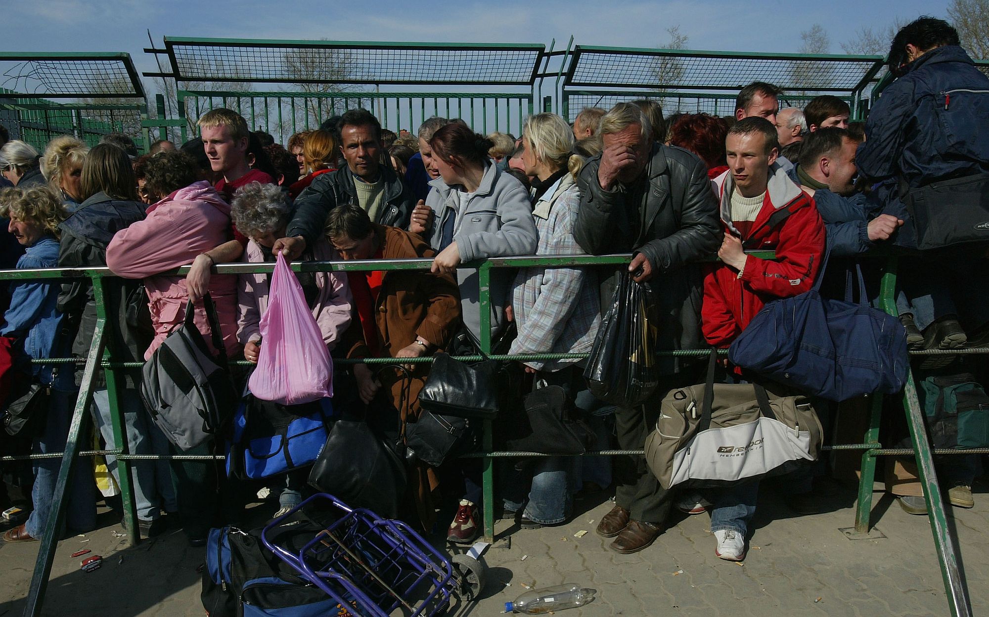 Ukrainian people wait to enter Poland on 16 April 2004, at what, a month later, became the EU's eastern border.