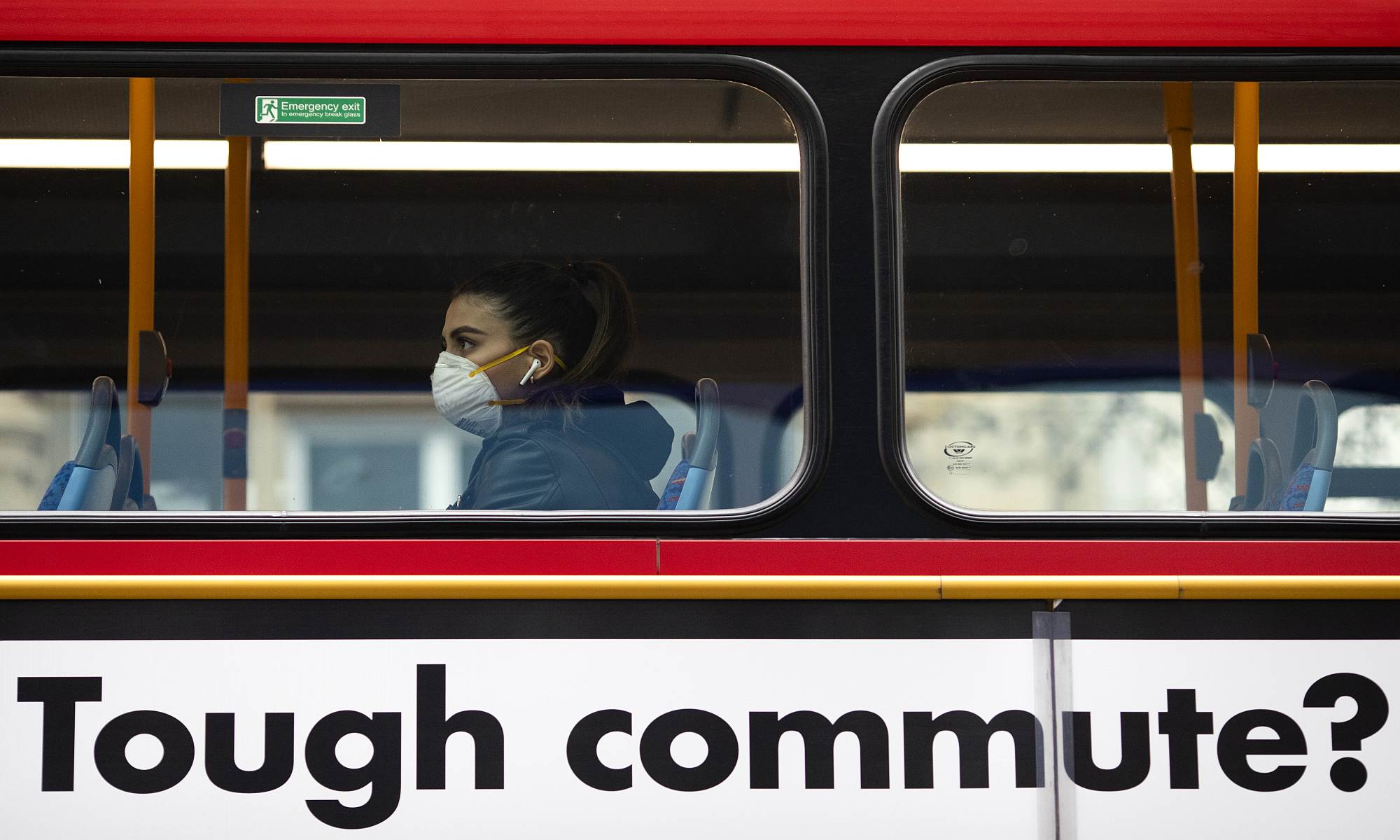 A passenger wearing a face mask rides bus on Oxford Street on 19 March 2020 in London, England.