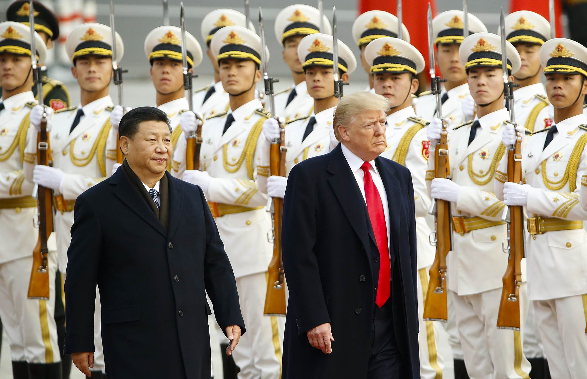 US President Donald Trump takes part in a welcoming ceremony with China's President Xi Jinping on 9 November 2017.
