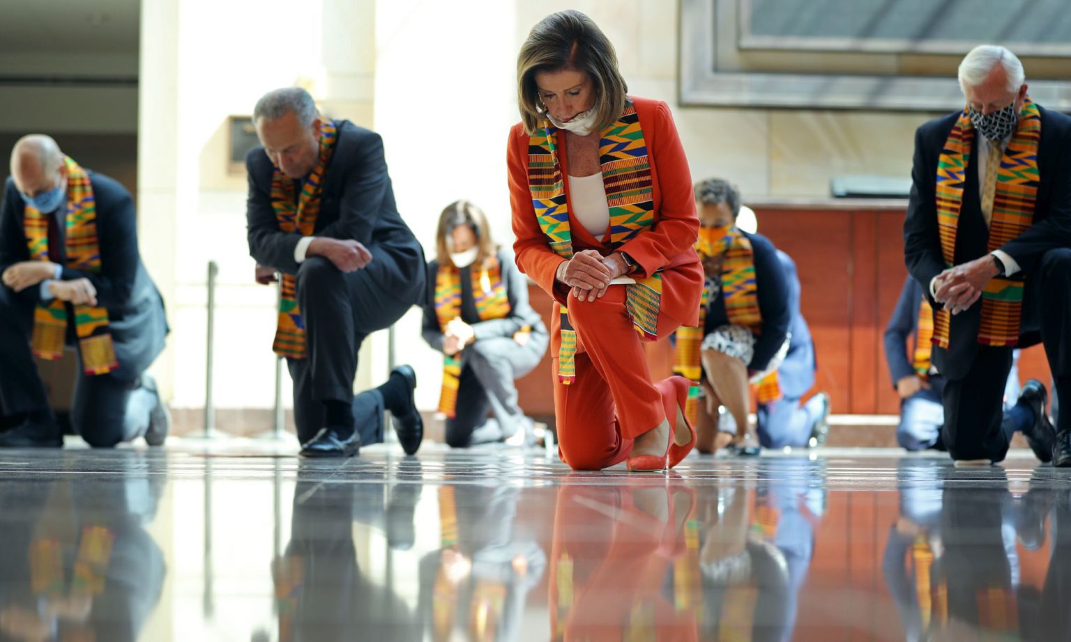 House Speaker Nancy Pelosi, alongside fellow Democrats from the House and Senate, takes the knee in the US Capitol Visitors Center, 8 June 2020.