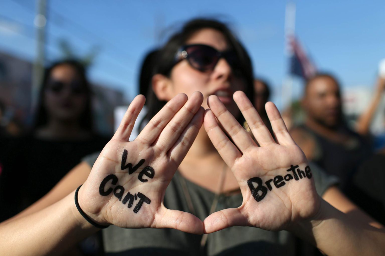 Demonstrators march through Miami to protest police abuse on 7 December 2014.