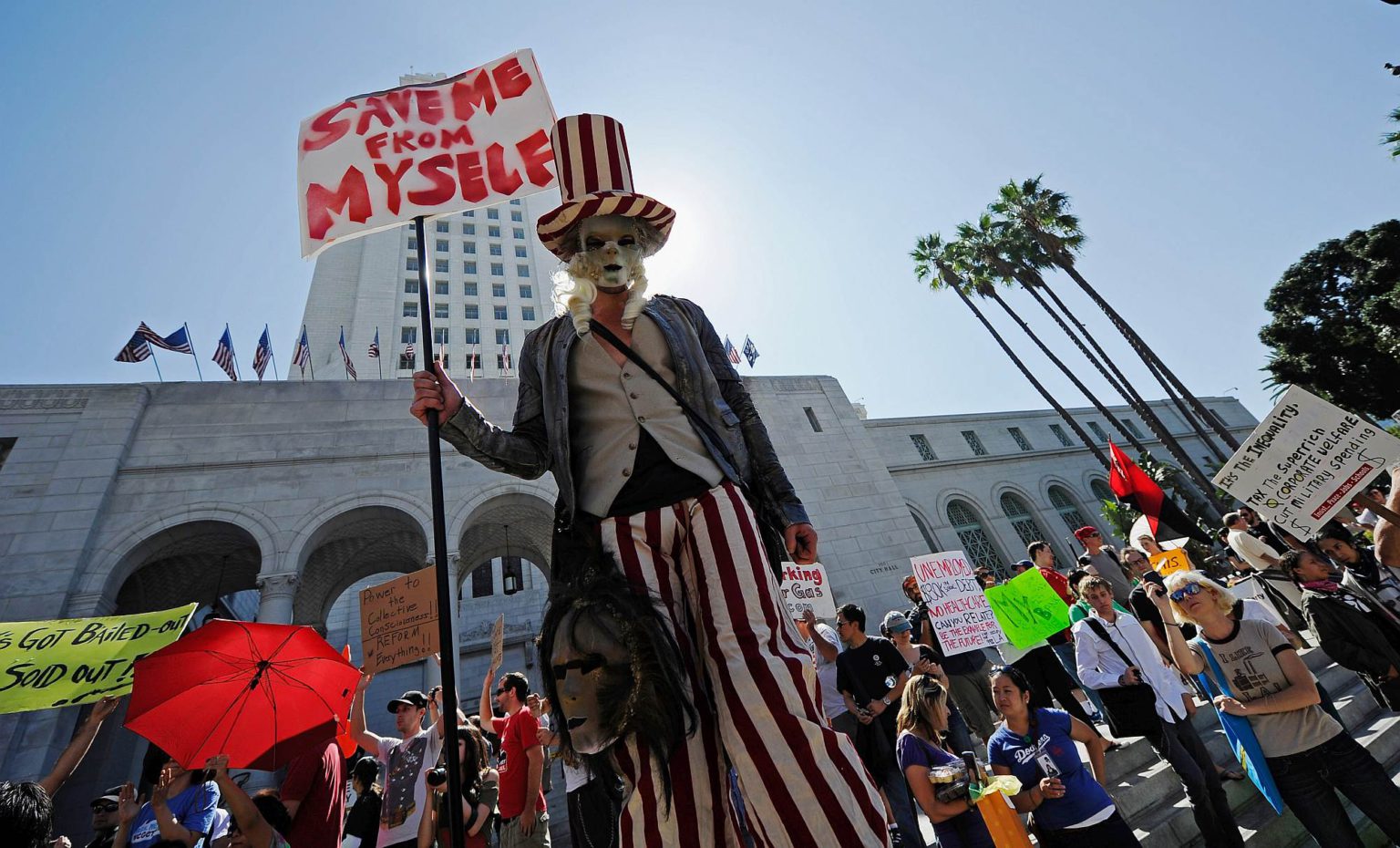Occupy protesters march to Los Angeles City Hall, 1 October 2011.