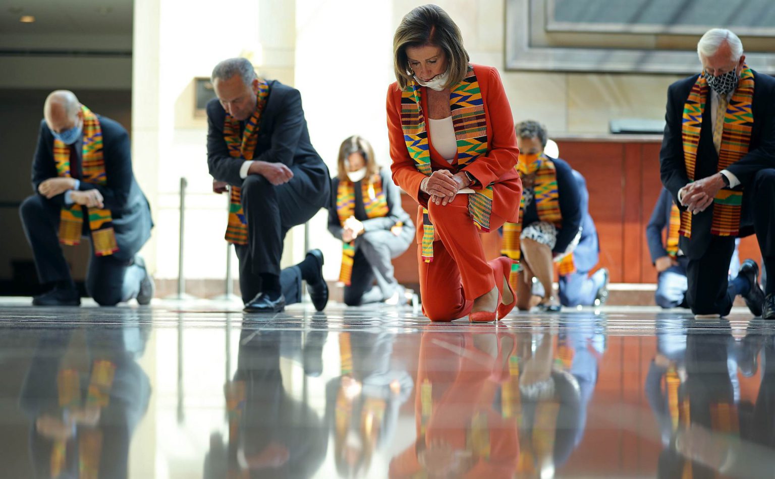 Democrats from the House and Senate kneel in silence to honour George Floyd in the US Capitol Visitors Center, 8 June 2020.
