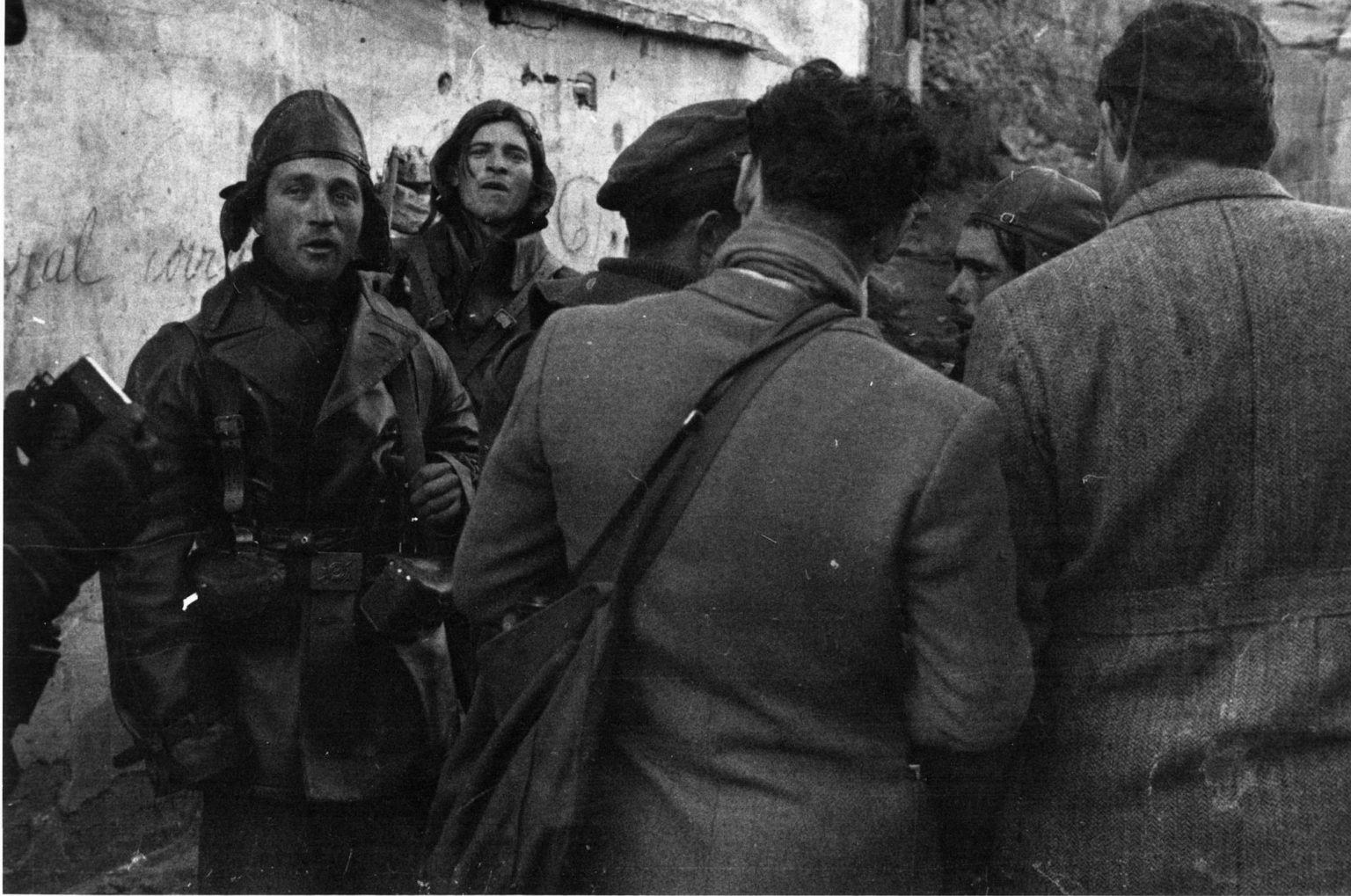 News reporters, including Ernest Hemingway (far right) mingling with members of the International Brigade, circa 1937