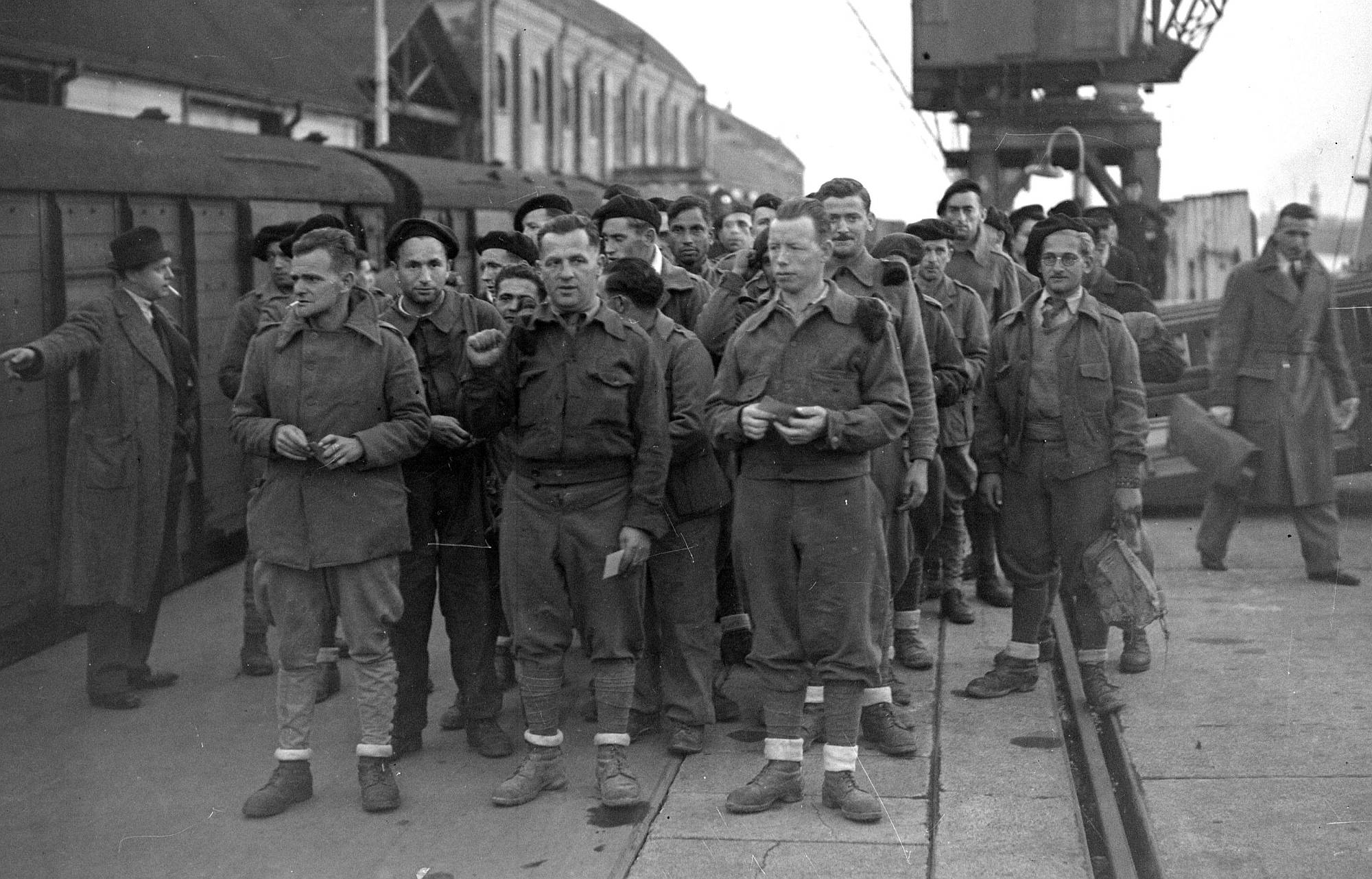 Ex-prisoners of war from the International Brigades arriving back in Britain, circa 1938.
