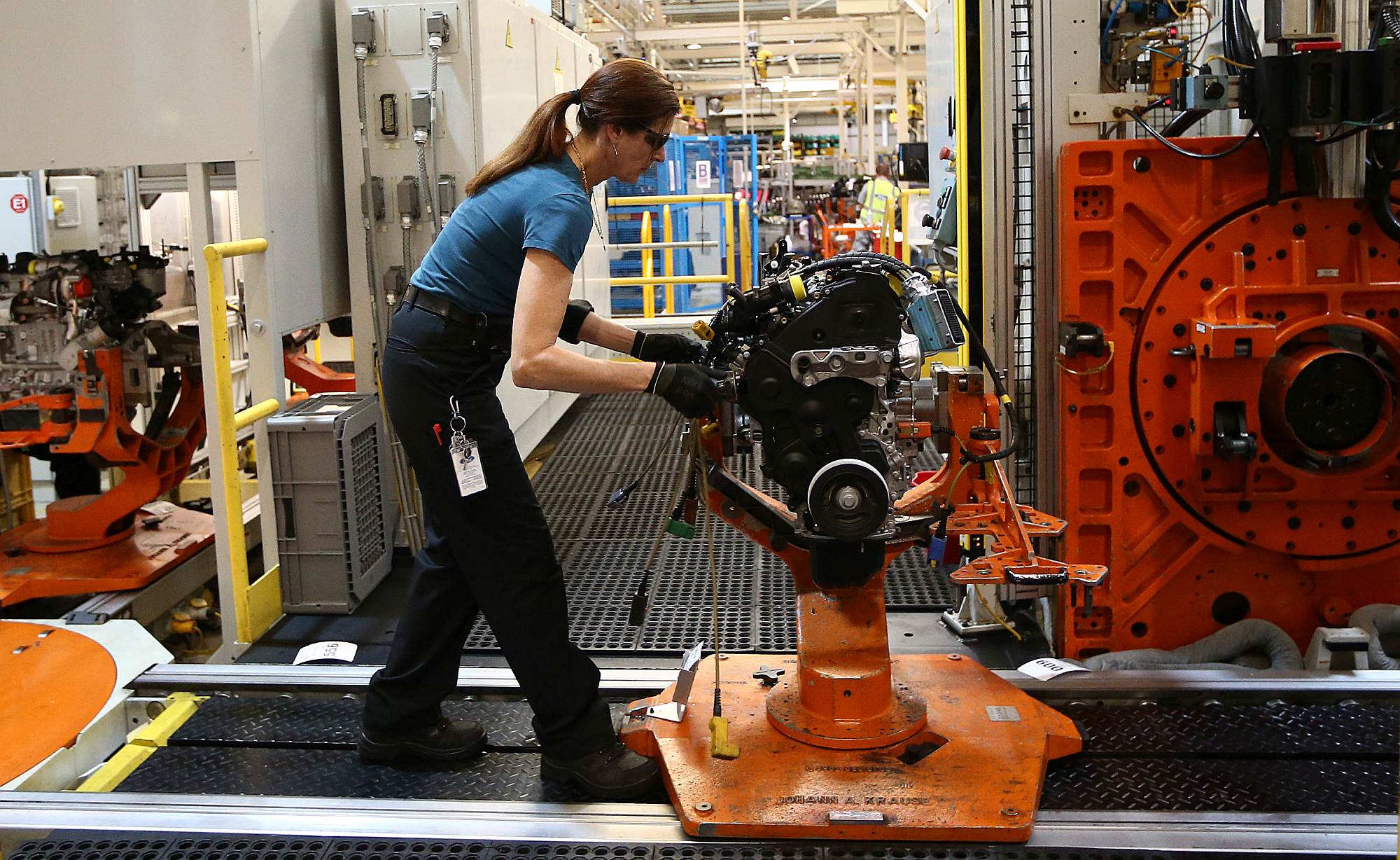 An employee works on an engine production line at a Ford factory, in Dagenham, on 13 January.