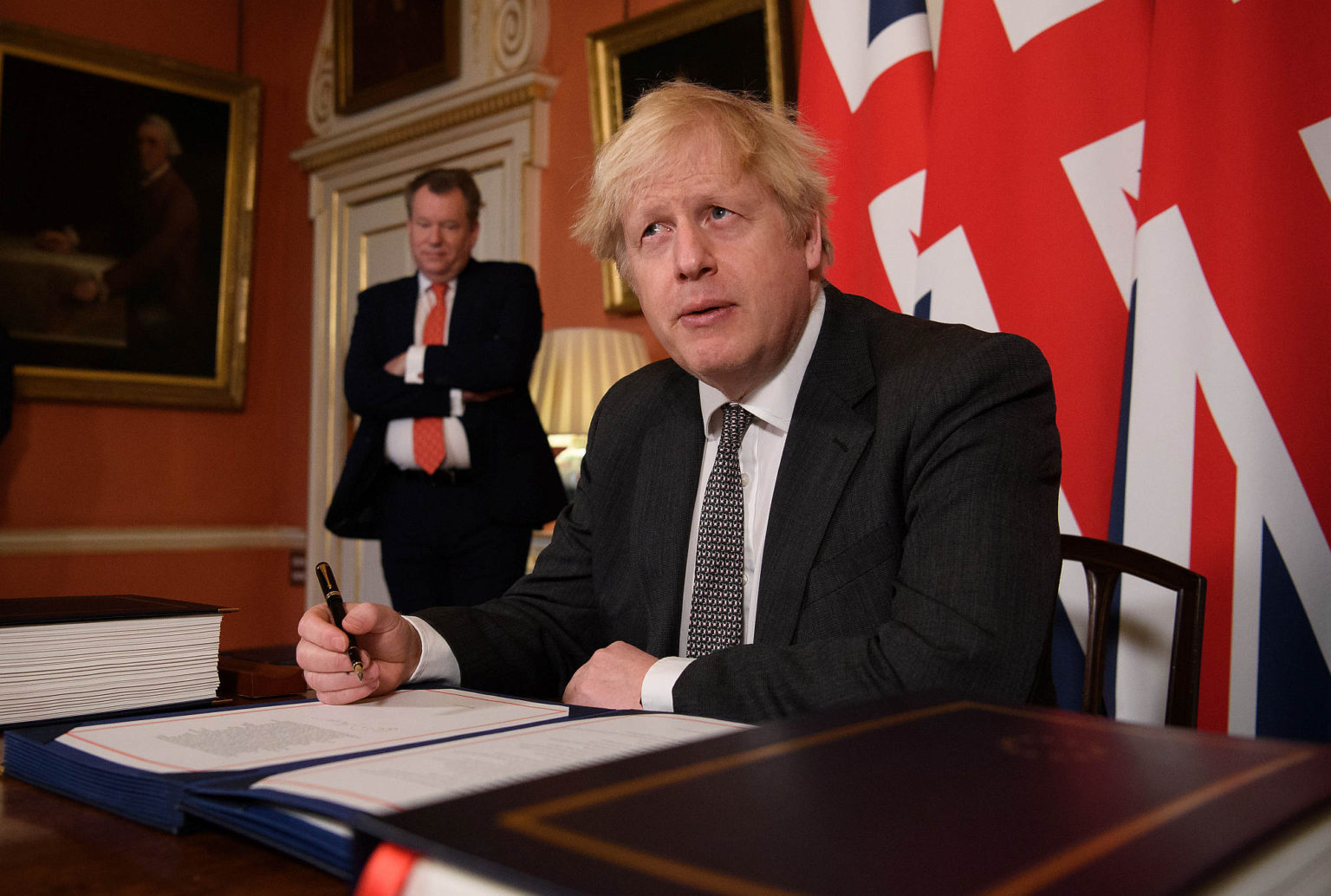 Boris Johnson signs the Brexit trade deal with the EU, London, 30 December 2020.
