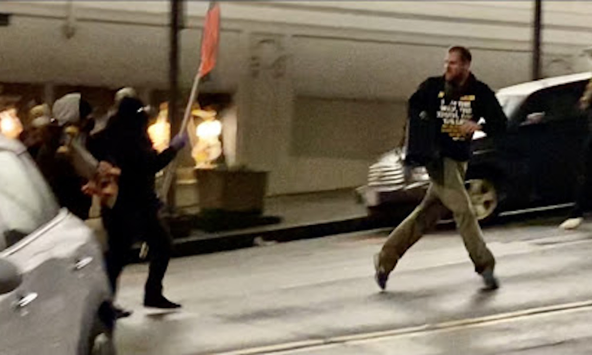 The Black Bloc moves on an evangelical counter-protester. Tacoma, Washington, 24 January, 2021.