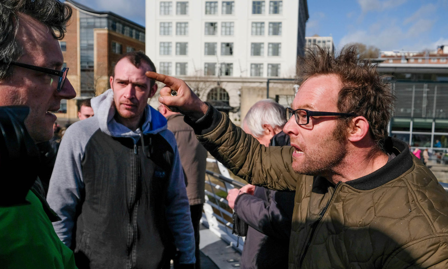 A Brexit supporter (right) argues with a pro-EU supporter on the Millennium Bridge, Newcastle Upon Tyne, 15 March 2019.