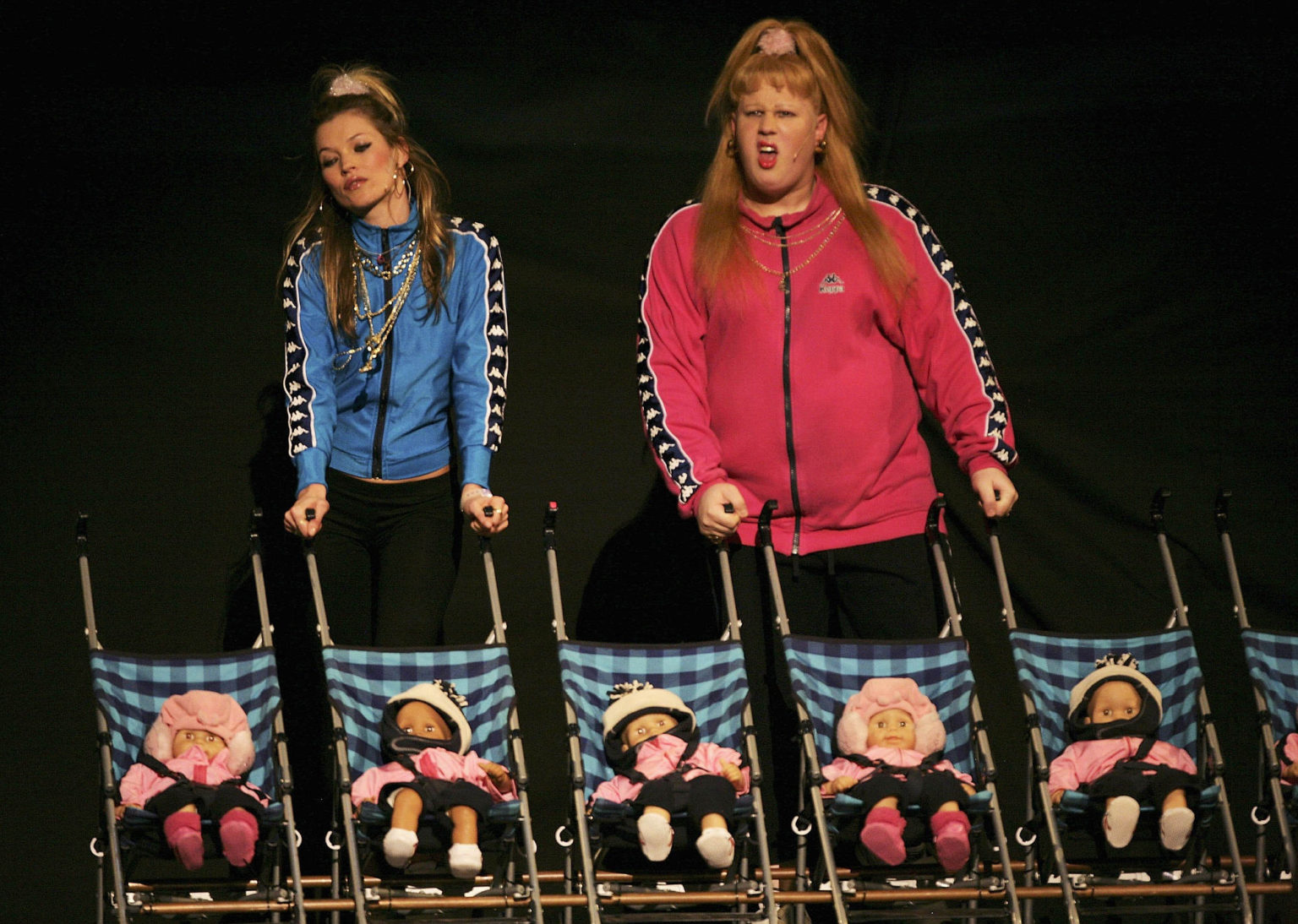Kate Moss and Matt Lucas, as the Pollard sisters Katie and Vicky, perform on stage in London, 22 November 2006.
