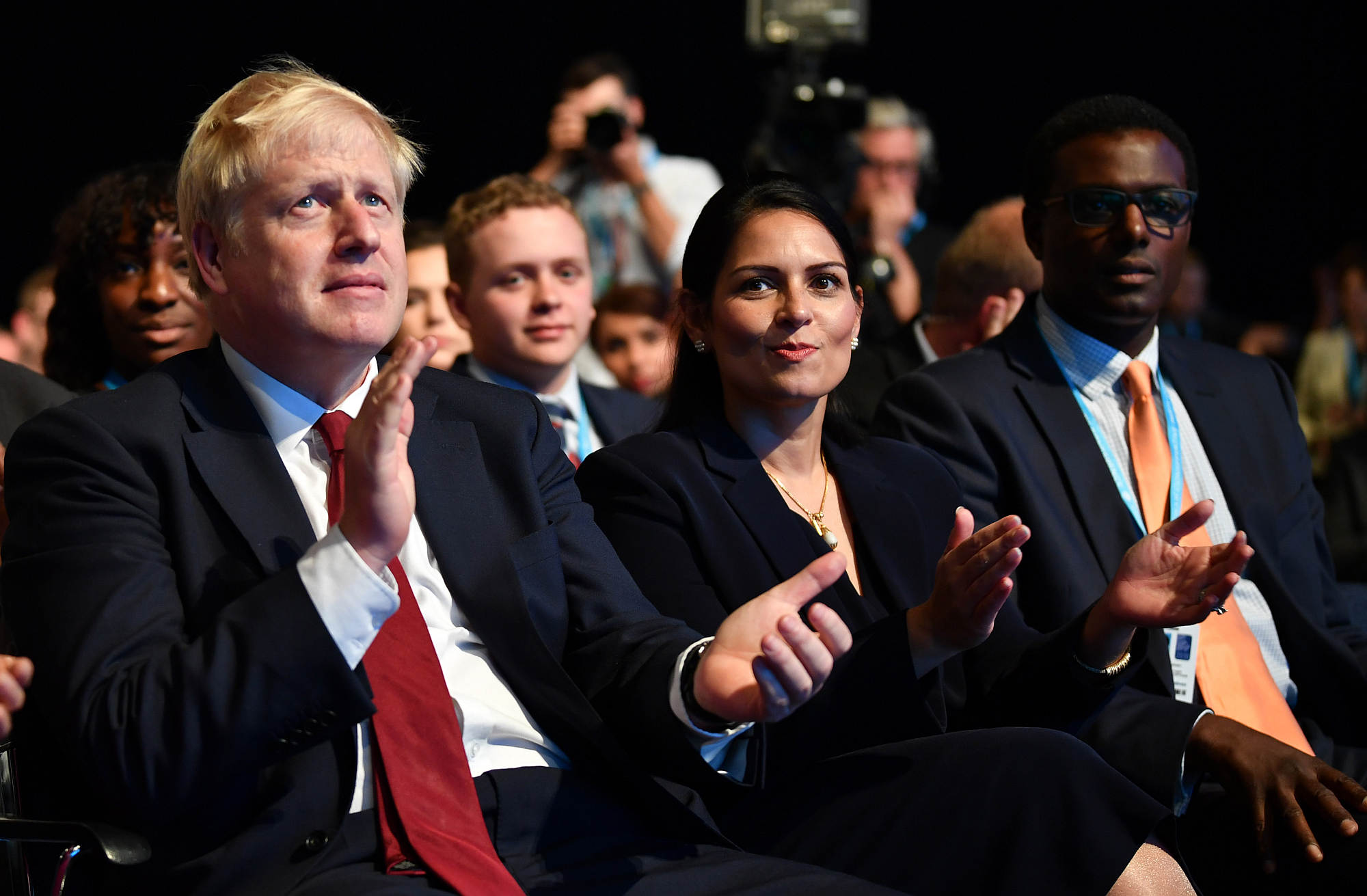Boris Johnson and Priti Patel at the 2019 Conservative Party conference in Manchester, England. (Credit: Getty Images.)