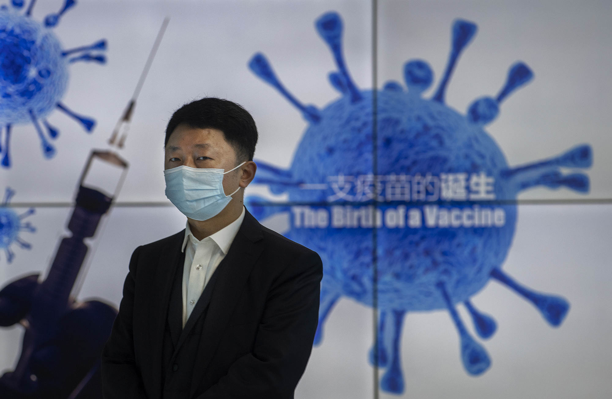 A Sinopharm representative promotes the Chinese-produced vaccine in Beijing, 26 February 2021.