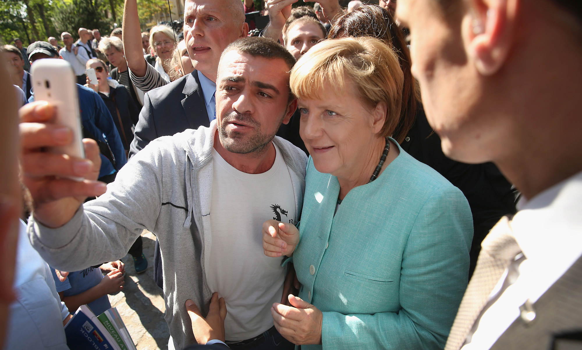 Merkel attends the AWO Refugium Askanierring shelter for migrants, in Berlin, 10 September 2015.