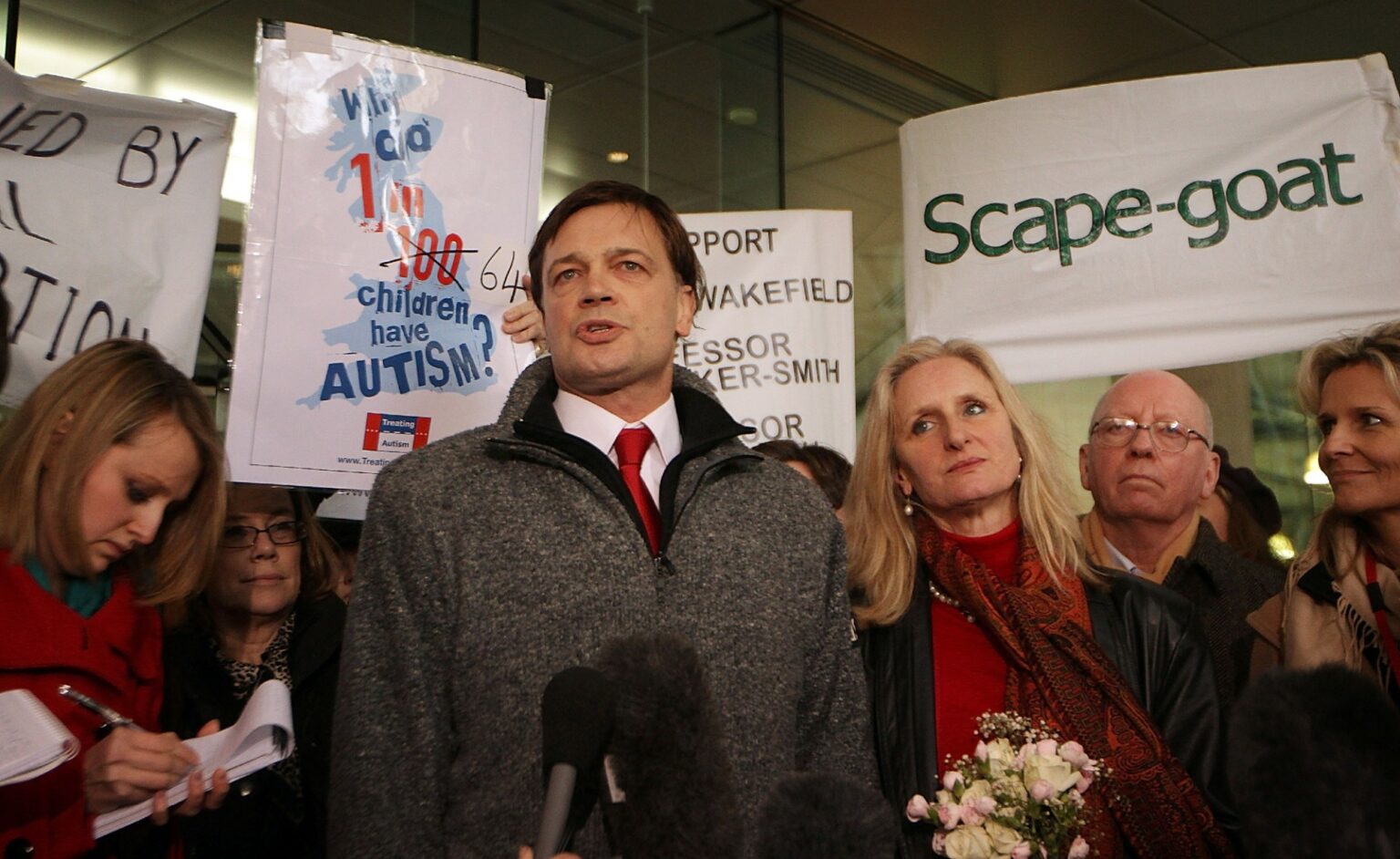 Andrew Wakefield stands with his wife Carmel as he talks to reporters at the General Medical Council, 28 January 2010.