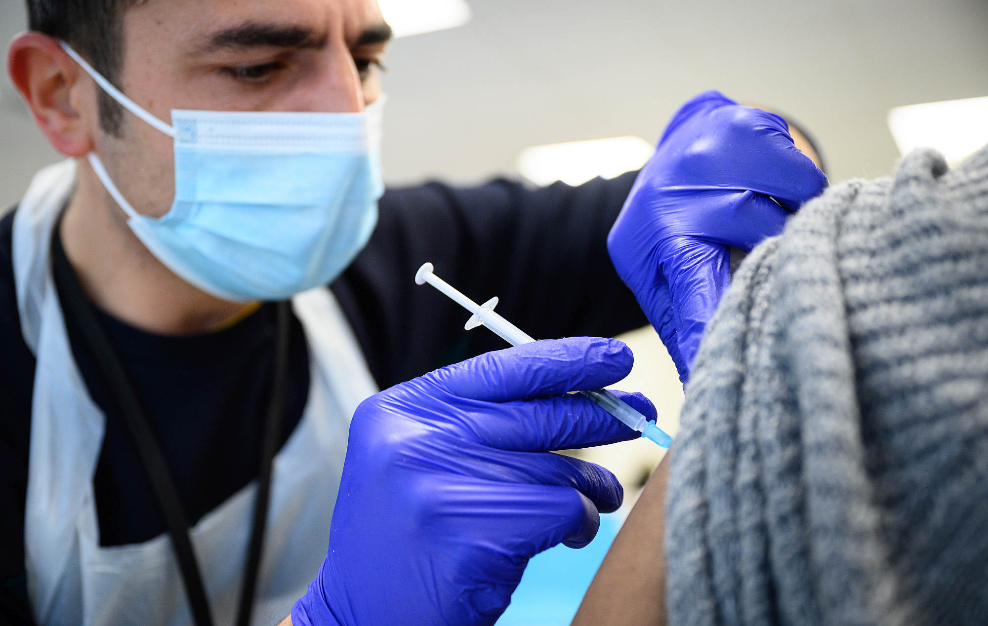 A woman receives her Covid booster jab on 10 November, in London, England.