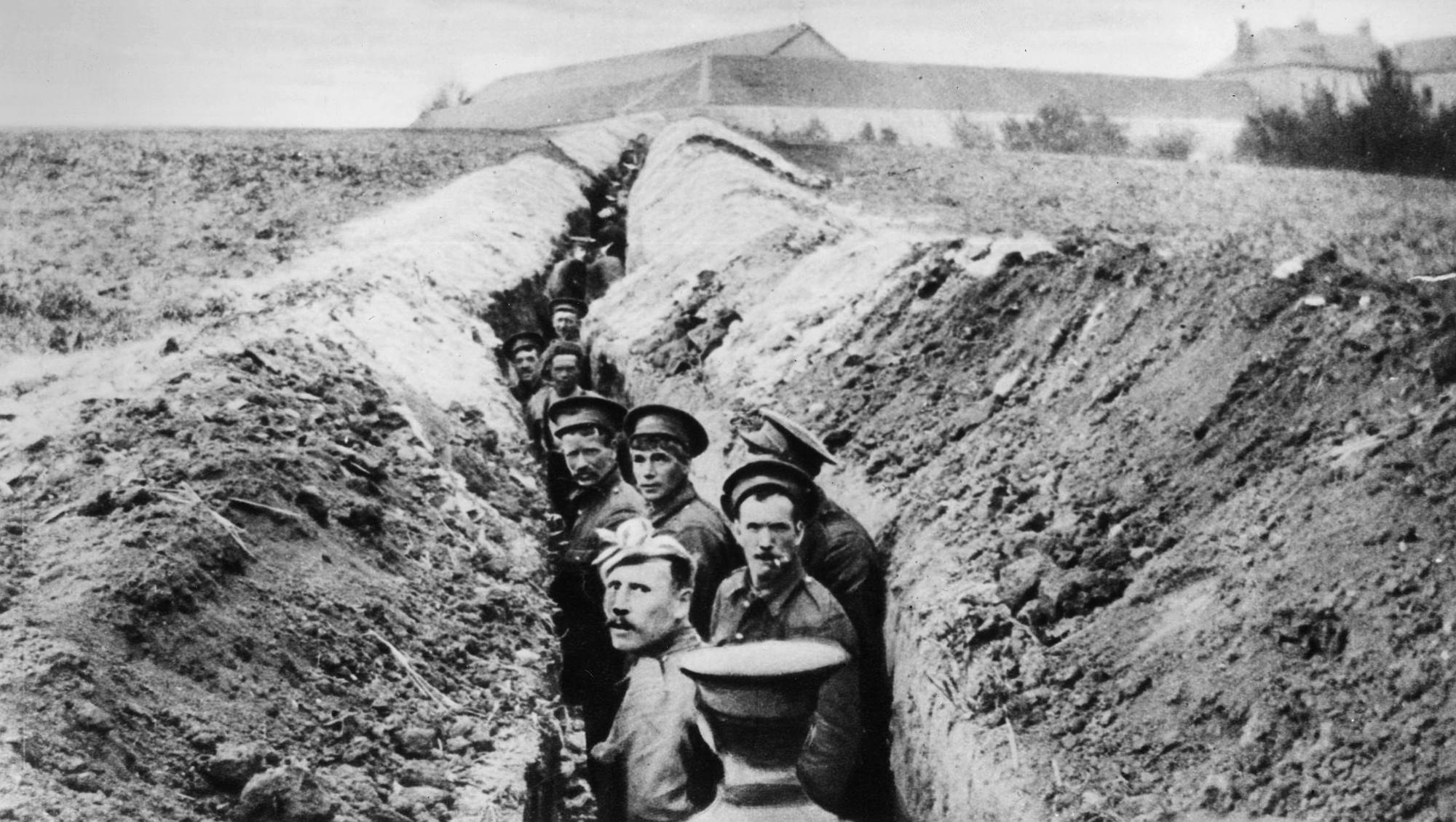 British soldiers line up in a narrow trench during the First World War, 28 October 1914.