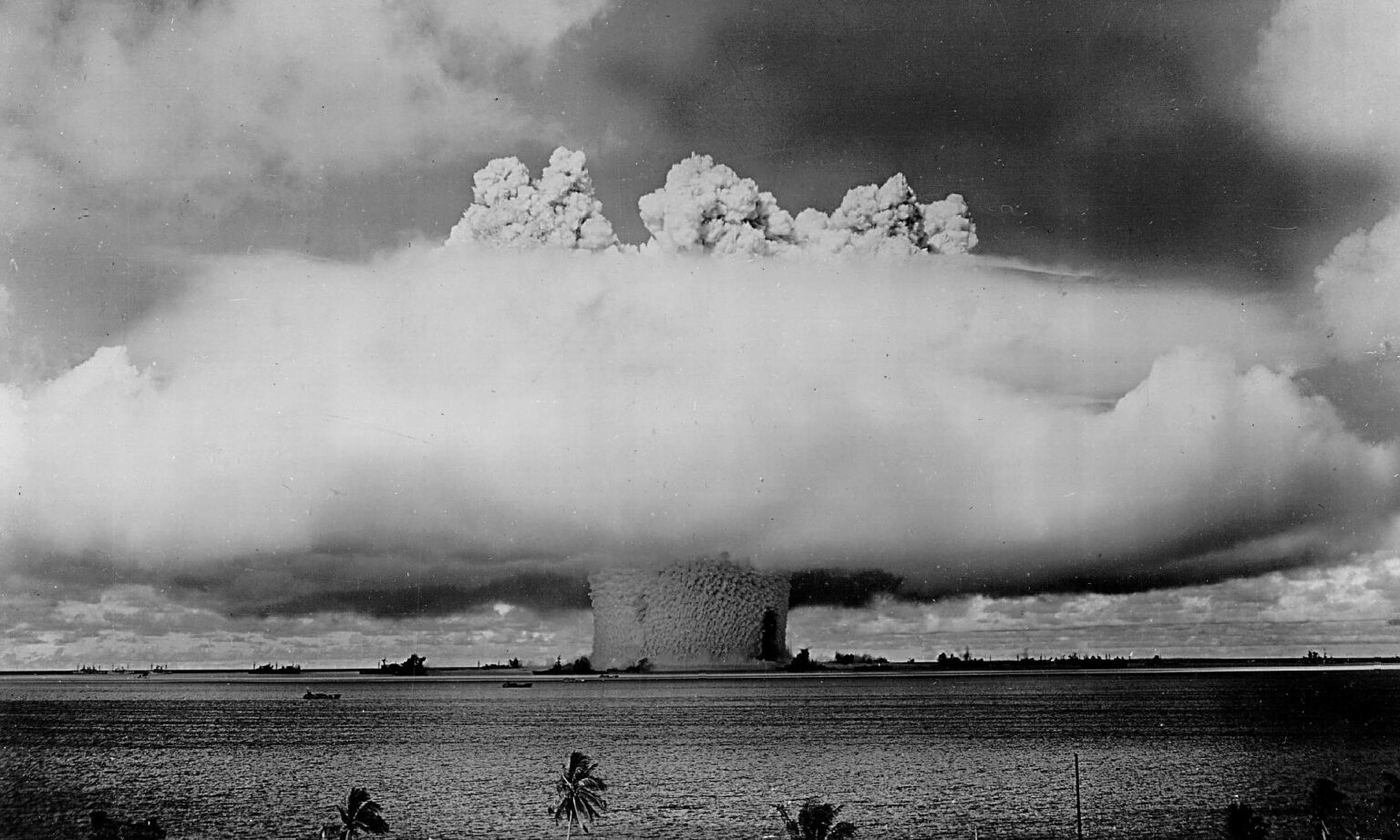 An atomic cloud rises during the 'Baker Day' blast at Bikini Island in the Pacific, 25 July 1946.