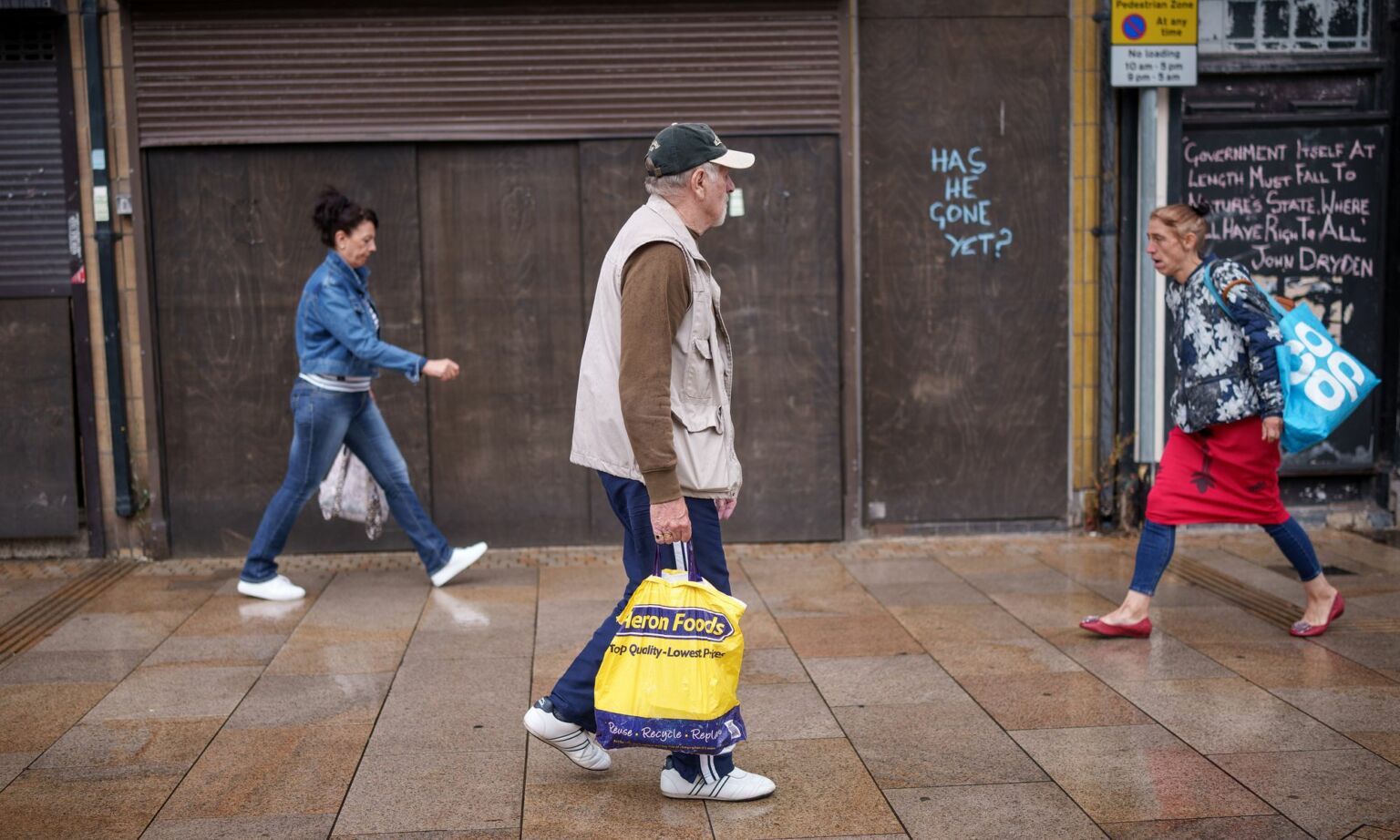 Shoppers walk past graffiti in Stoke-on-Trent, August 05, 2022.
