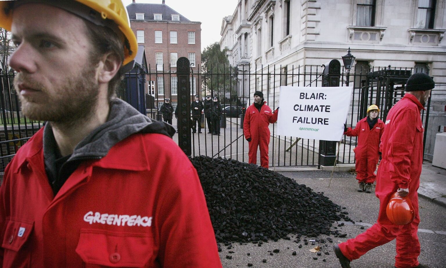 Greenpeace campaigners protest outside the back entrance to the official residence of British prime minister Tony Blair in 2005.