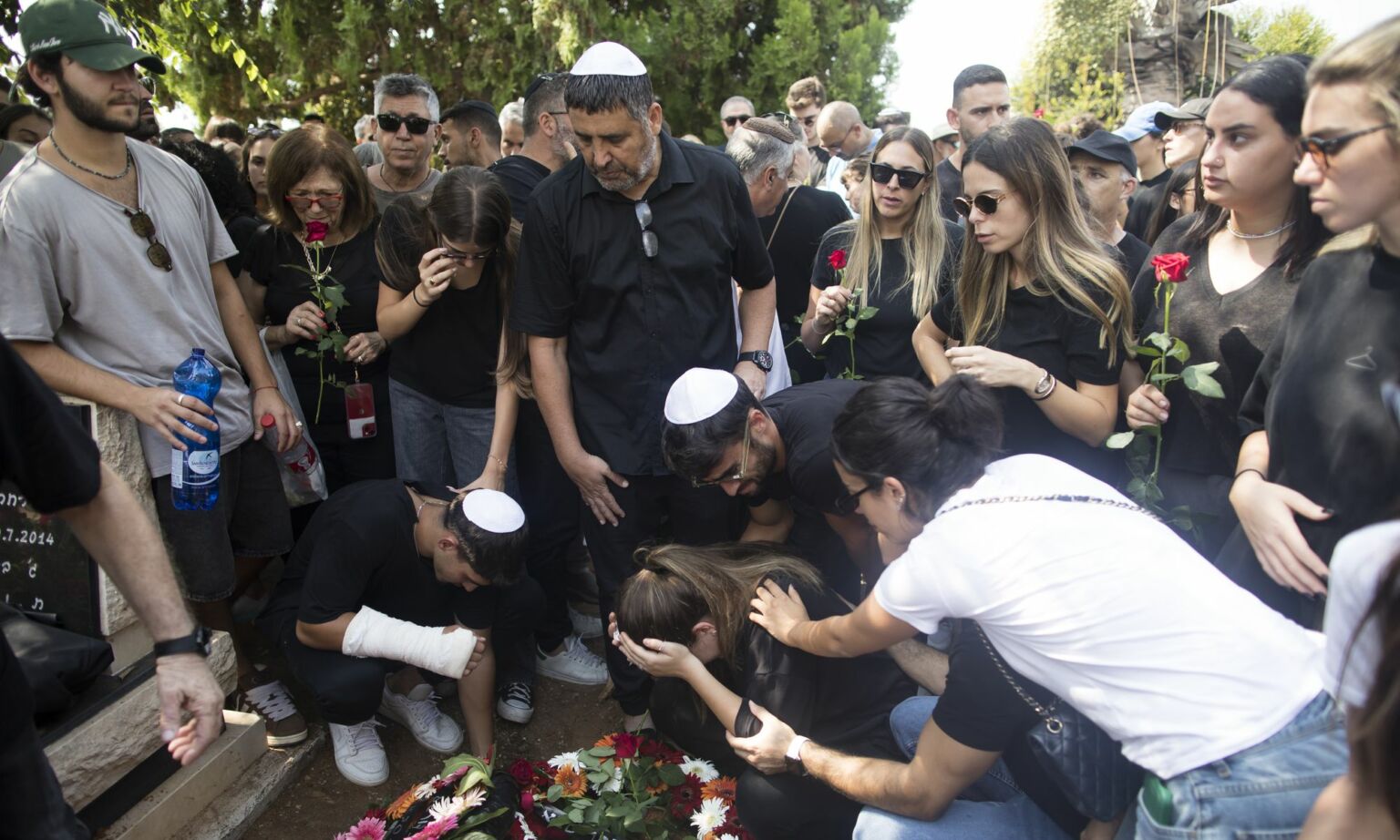 Family and friends of May Naim, 24, who was murdered by Hamas terrorists at the 'Supernova' festival, near the Israeli border with Gaza strip, react during her funeral on October 11, 2023.