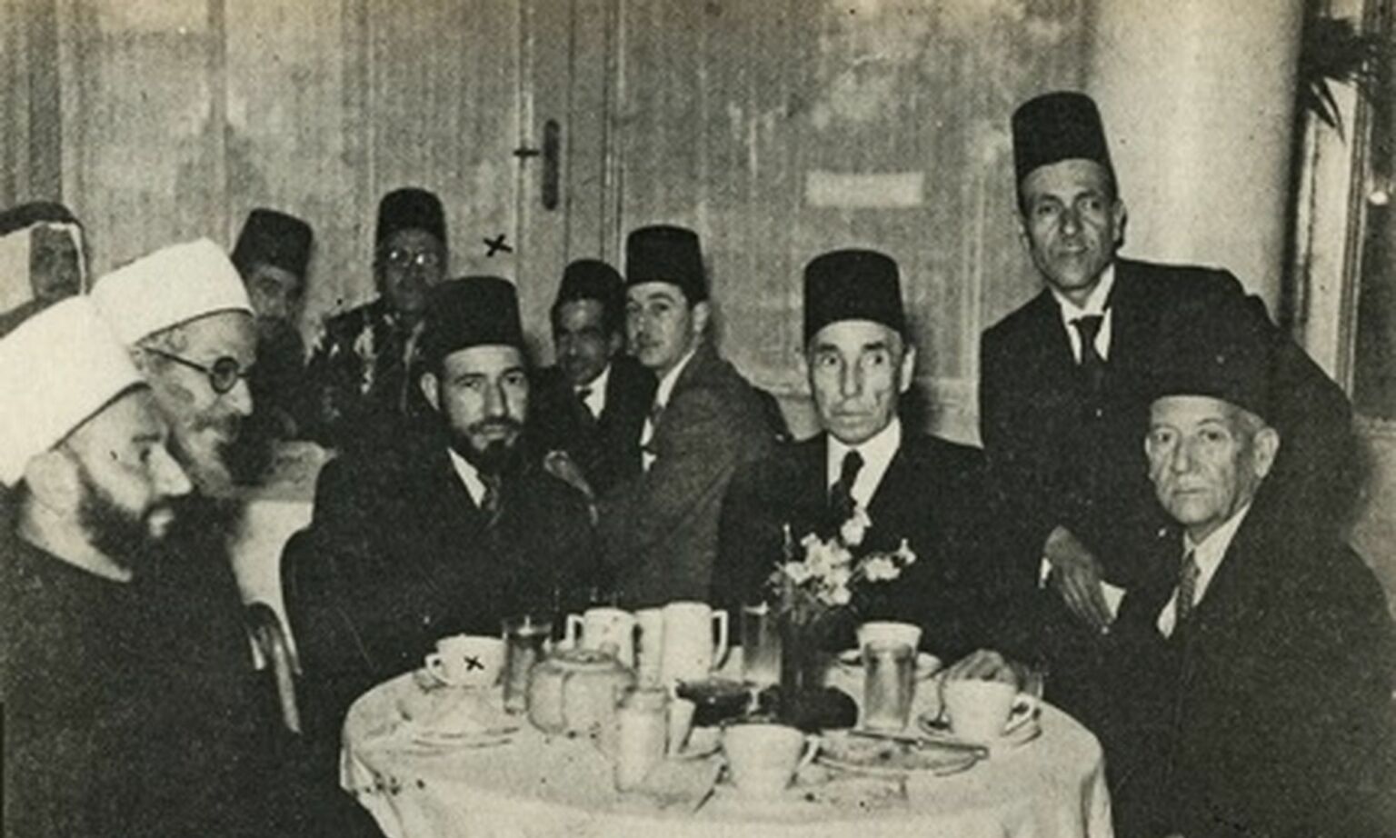 Muslim Brotherhood founder Hassan Al-Banna with political and religious figures at a reception in Cairo, 1947.