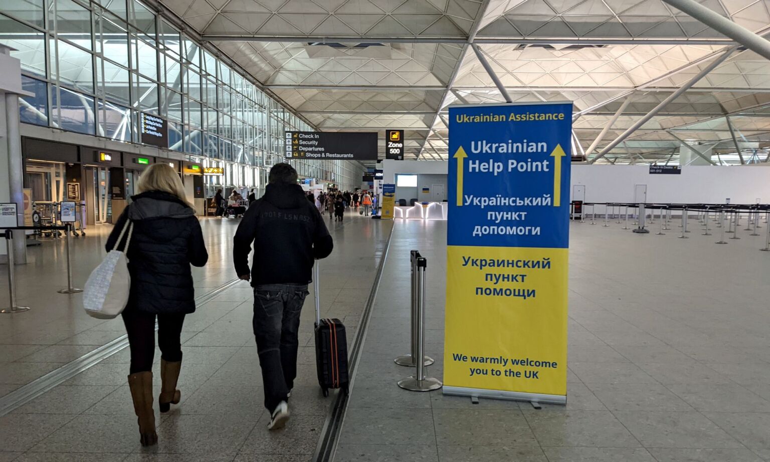 Welcome signs for Ukrainian refugees at Stanstead Airport, London.