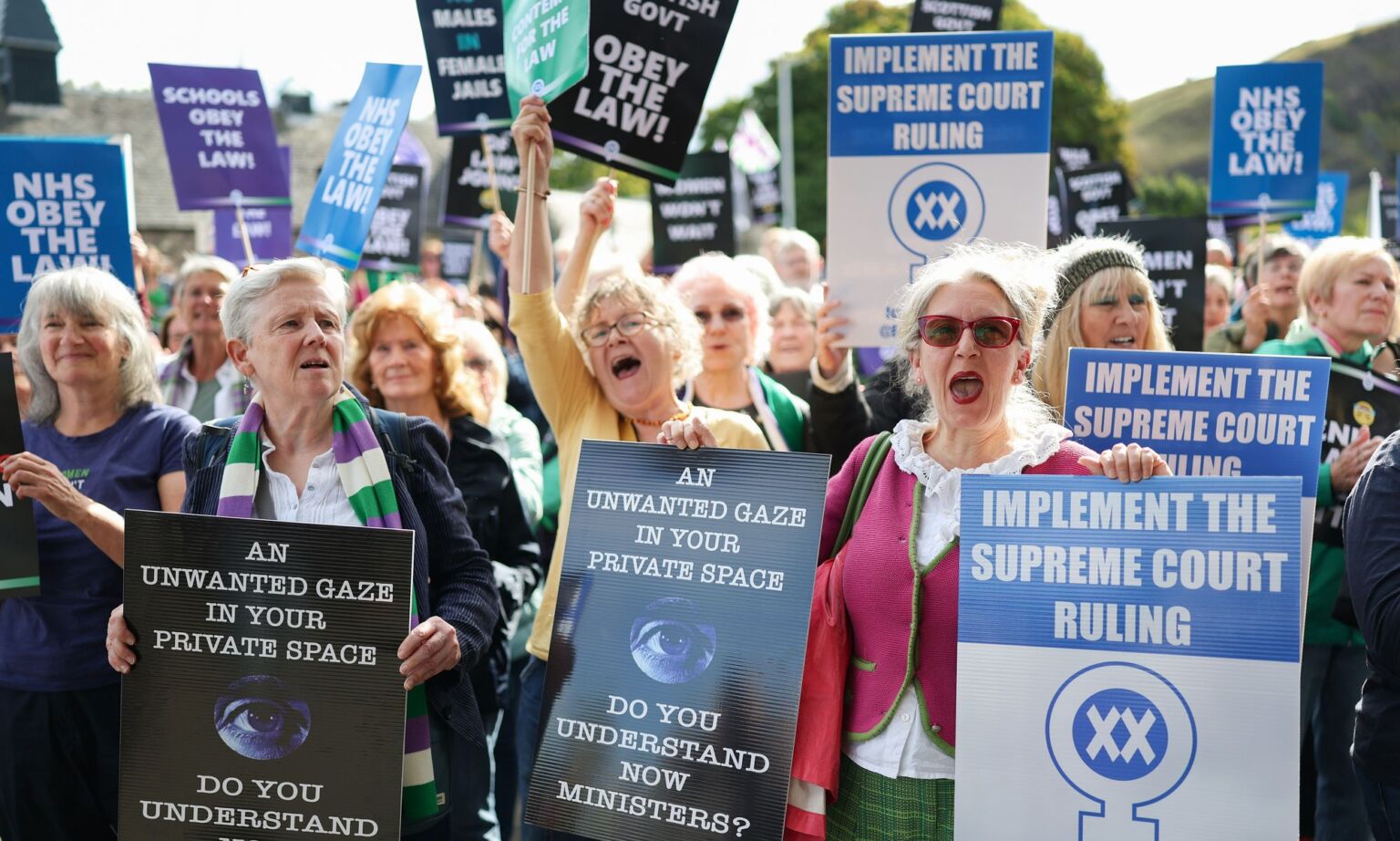 Protesters gather outside the Scottish Parliament to call on the government to enforce the supreme court ruling on gender, 4 September 2025.
