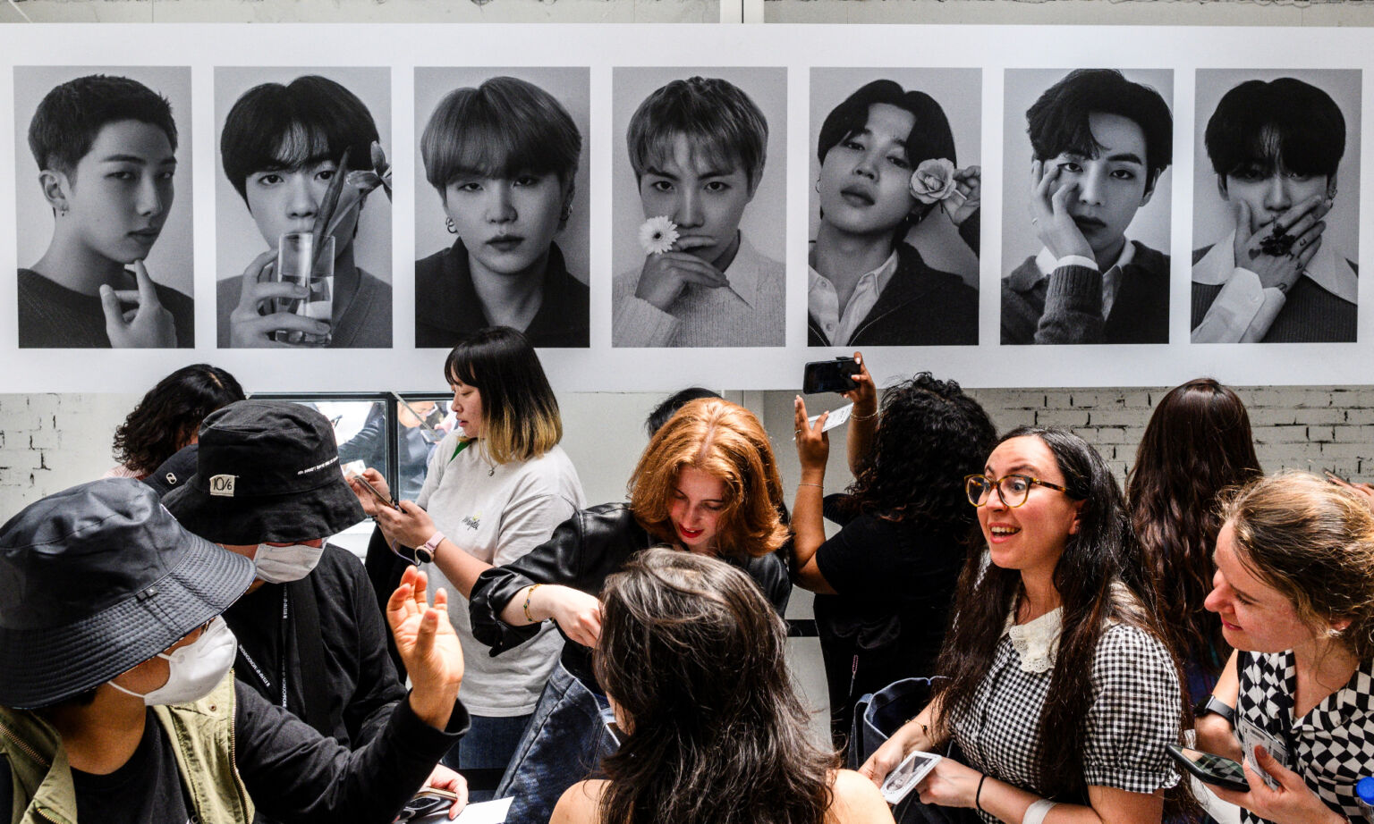 Fans wait at a a pop-up store selling BTS merchandise in Seoul, on 26 April 2024.