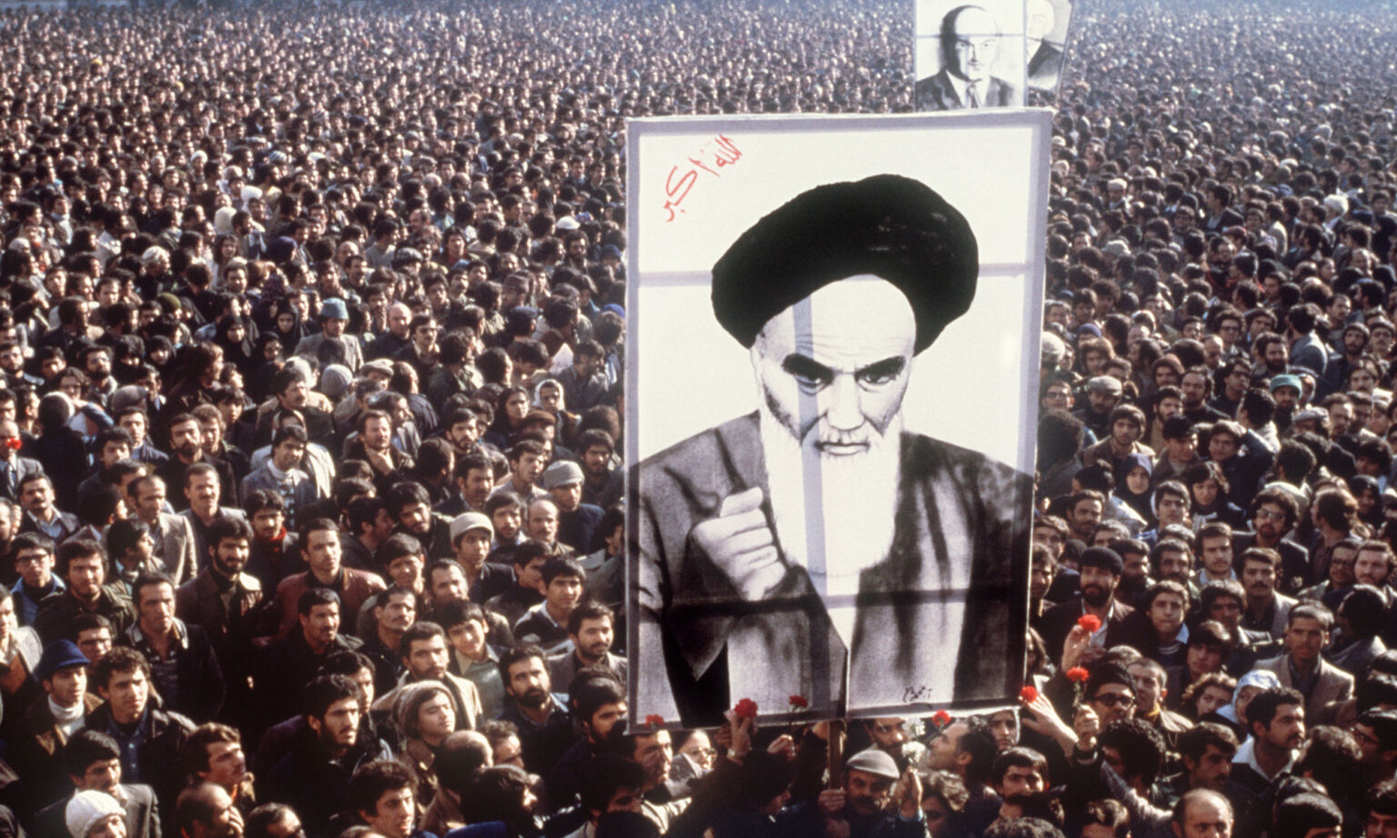 Demonstrators hold a poster of Ayatollah Ruhollah Khomeini, in January 1979, in Tehran, during a demonstration against the shah.