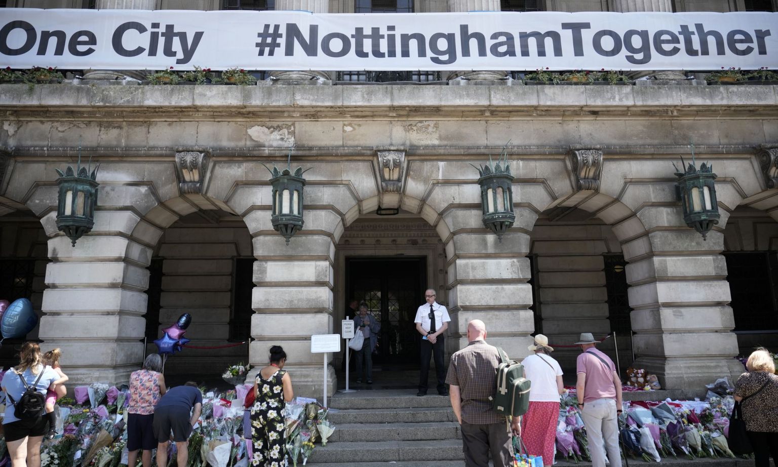 Flowers, balloons and tributes to Barnaby Webber, Grace O Malley-Kumar and Ian Coates lay on the steps of Nottingham Council House.